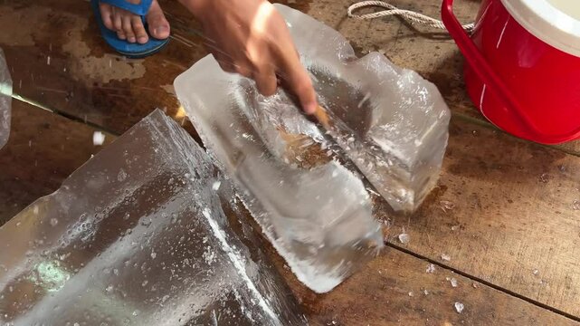 break the ice chop ice cut large chunks of ice for a drink fridge take with you to the countryside in a wooden house homemade fridge chop blocks of ice with a knife