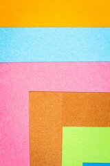 Fototapeta premium Multicolor background from a paper of different colors. Abstract colorful vibrant paper textures.