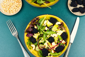 Fresh salad bowl with raw blackberries.