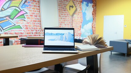 open books and laptop on the table