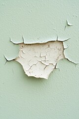 A flawed wall with flaking paint, exposing layers of disregard that narrate tales of age and accumulated grime.