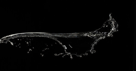 Throwing water to object make curve drop splash in explosion motion. Black background isolated....