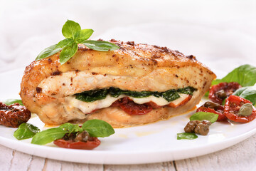 Baked chicken breast with spinach, sun-dried tomatoes and mozzarella