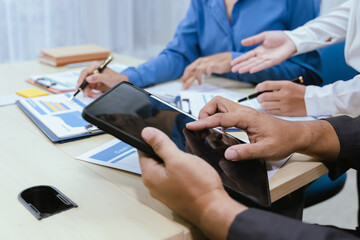 Fototapeta premium A collaborative office environment where professionals brainstorm, discuss strategy and work together to drive growth, innovation and leadership across business areas.
