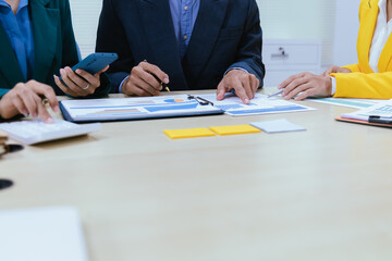 A busy office environment where teams collaborate on creative projects, finance, and marketing strategies using data, charts, and reports, engaging in brainstorming and training sessions to achieve bu