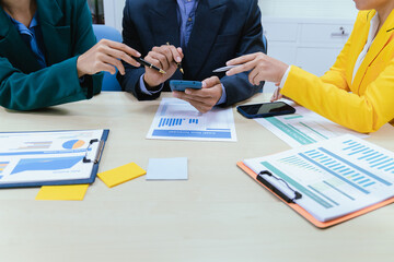 A busy office environment where teams collaborate on creative projects, finance, and marketing strategies using data, charts, and reports, engaging in brainstorming and training sessions to achieve bu