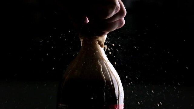 Man Opens A Cola Zero Bottle, Causing Drops And Splashes Of The Zero Sugar Diet Drink