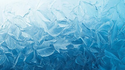 Obraz premium Frozen pattern on winter window. Blue ice winter background, texture blue wallpaper. Banner of fozen blue background