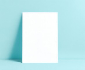 Naklejka premium A4 size paper blank mockup on blue background .Blank paper card on a blank wall mockup . modern decoration for cv and official work