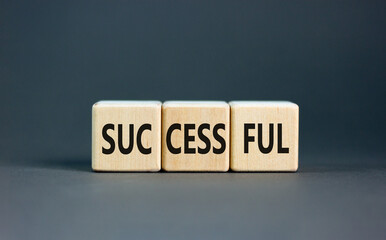 Successful symbol. Concept word Successful on beautiful wooden blocks. Beautiful grey background. Business successful concept. Copy space.