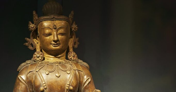 Close-up view on Gilt Bronze Statue Of Vairocana -also Mahavairocana- Is Cosmic Buddha From Mahayana And Vajrayana Buddhism. In Conception Of Five Jinas Of Mahayana And Vajrayana Buddhism, Vairocana
