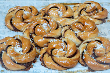 Homemade delicius sweet cinnamon rolls in the window of a pastry shop