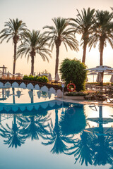 beach umbrellas, sun loungers by the pool, rest, relax, summer vacation