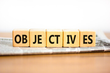 Objectives symbol. Concept word Objectives on beautiful wooden blocks. Beautiful wooden table white...