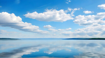 Obraz premium A large calm lake with clouds in the sky