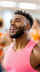 Obraz premium A man performing aerobics in a group fitness class, with other participants following along energetically, capturing the rhythm and intensity of the workout