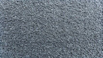 Sandpaper texture in gray with a rough finish for industrial and creative applications