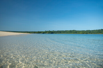 Beautiful, untouched natural blue - turquoise green lagoon and natural beach in the Coiba island national park, Veraguas, Panama - stock photo