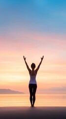 Obraz premium A person practicing yoga at sunrise on a quiet beach, symbolizing inner peace and well-being