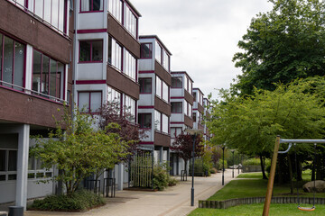 Residential building with a green area. Real estate investment. Expensive housing.