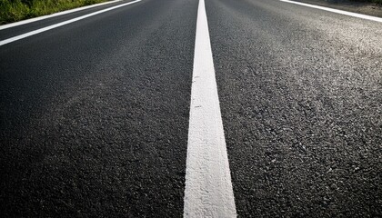 black asphalt road and white dividing lines