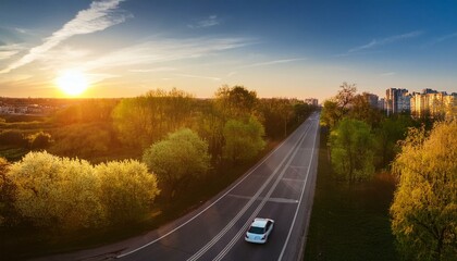 Fototapeta premium car on the road on sunny spring evening in city