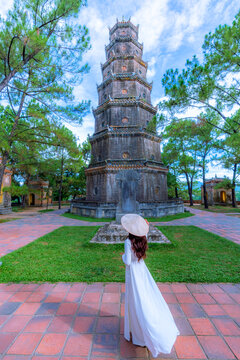 Asian woman visits Thien Mu Pagoda It is one of the ancient pagodas in Hue city. Near the Perfume River in the historic city of Hue, Vietnam.