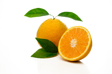 Orange fruit. Slices with leaves isolated on white.
