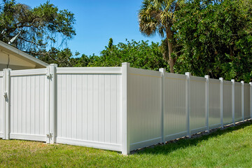 Fototapeta premium White Vinyl Fence with white hinges