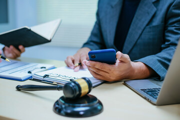 Two lawyers consult in a modern office, presenting compelling arguments and demonstrating their...