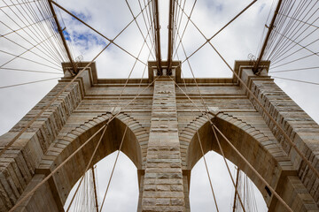 Fototapeta premium Brooklyn Bridge Tower Against Cloudy Sky