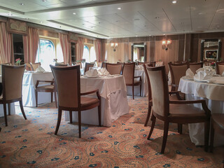 Art Deco interior design style furniture, carpets and paneling onboard classic ocean liner cruiseship cruise ship main dining room restaurant