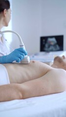 Obraz premium Doctor woman with blue medical gloves performing an ultrasound scan of male patient breast lying down in clinic. Cardiology diagnosis concept