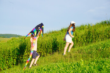 Father and kids playing in the meadow