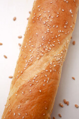 Baguette with sesame seeds close-up