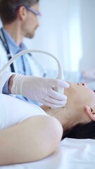 Obraz premium Doctor man wearing white protective gloves is using ultrasound machine to examine neck of female patient in hospital. Medicine, thyroid gland health