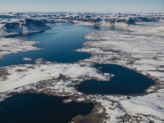 Fototapeta premium Aerial view of snow-covered highlands and lakes in Iceland.