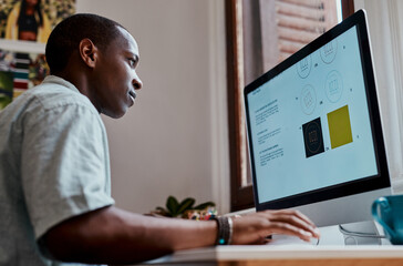 Business, black man and graphic designer on computer in office for creative startup logo design. Website, screen and artist working on project for social media platform, update or development online