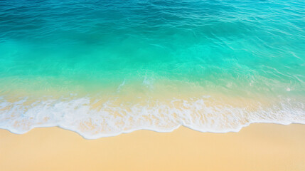 Powerful ocean waves crash onto a sandy beach, capturing the dynamic movement and natural beauty of the seashore.