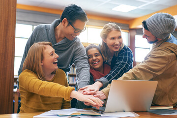 Laptop, library and students with hands together in study group with university, education and solidarity. Books, online research and people on campus for team project, knowledge or support in growth