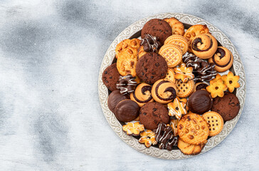 Mix of cookies . Many unhealthy snacks . Top view