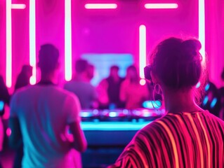A vibrant nightlife scene featuring people enjoying music and dancing under neon lights in a modern club environment.