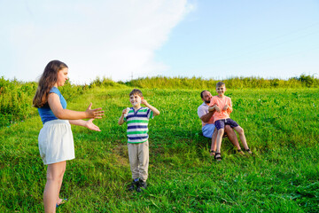 Father and kids having fun and blowing soap bubbles.