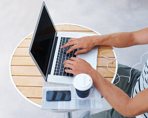 Hands, typing and creative with laptop, coffee and freelancer with website, online and video...