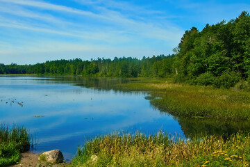 Sunny Summer landscape of a peaceful lake in the forest near Sayner, Wisconsin.
