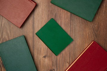 Fototapeta premium Books on wooden background from above. Flat lay, top view.