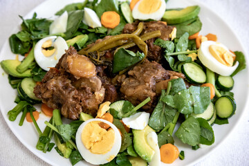 Beef oxtail cooked with watercress and served with salad. Hearty and nutritious low carb food