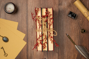 Vintage composition with books on wooden background from above. Flat lay, top view.