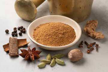 Heap of traditional spicy coffee herbs and dried herbs around close up
