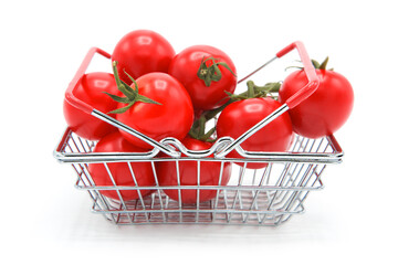 Shopping supermarket basket with fresh ripe organic tomatoes on a branch whole isolated on a white background. Purchase of products. Agricultural products and harvesting.